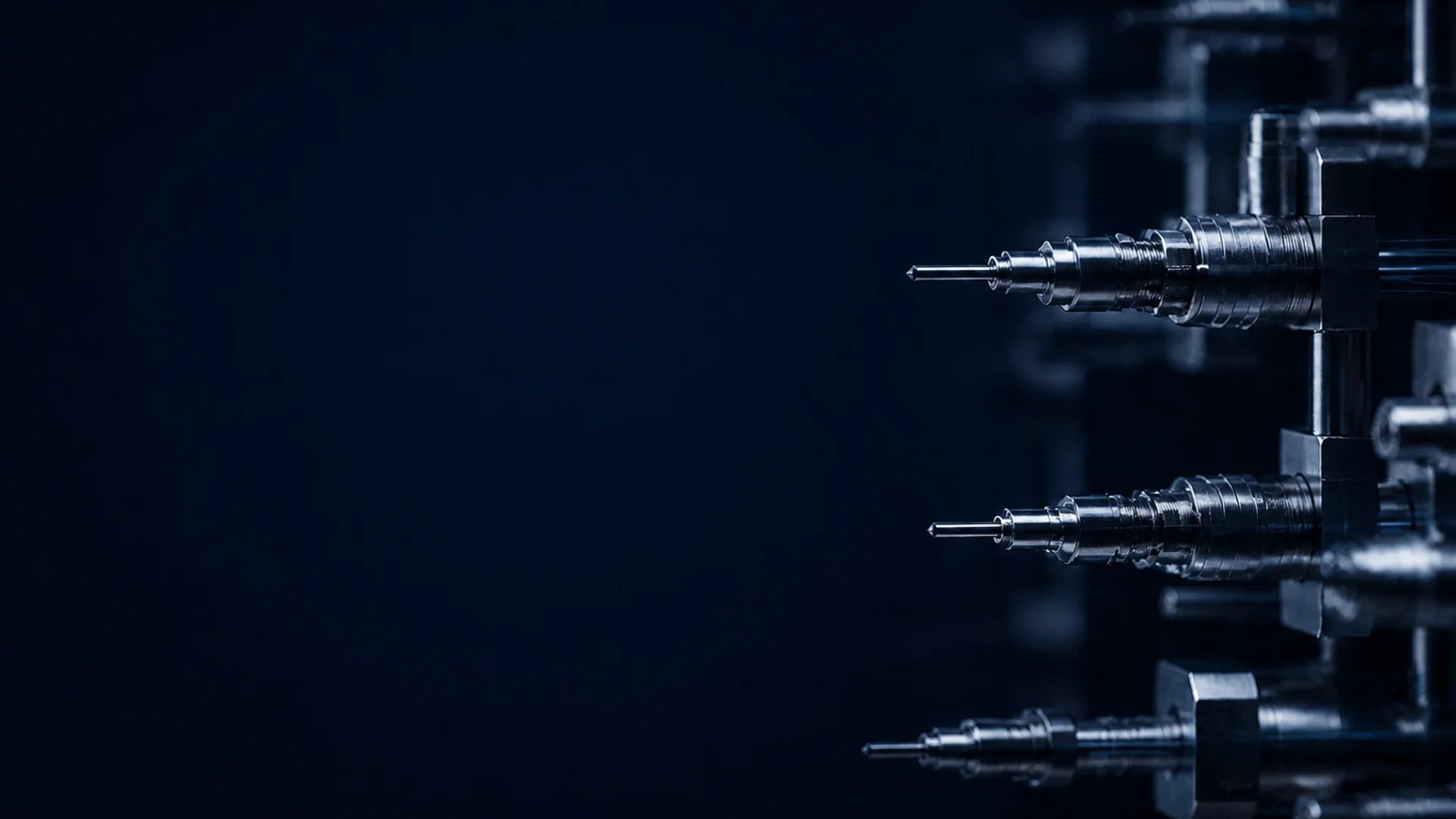 Close-up of precision metal contact equipment in a deep navy setting